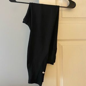 Nike dry fit size small activewear leggings with mesh leg detail.